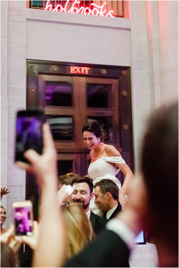 Ohio Statehouse reception bride lifted in air on chair